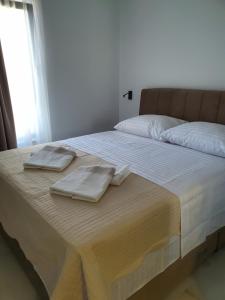 Postel nebo postele na pokoji v ubytování Bellissima Apartments