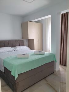 Postel nebo postele na pokoji v ubytování Bellissima Apartments