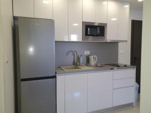 Kuchyň nebo kuchyňský kout v ubytování Bellissima Apartments