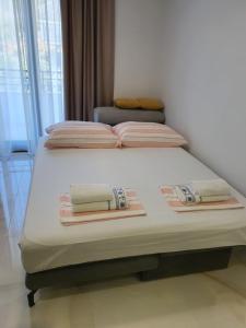Postel nebo postele na pokoji v ubytování Bellissima Apartments