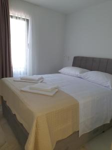 Postel nebo postele na pokoji v ubytování Bellissima Apartments