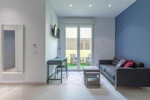 a living room with a couch and a table at Sunny,Private Terrace,Wheelchair access in Valencia