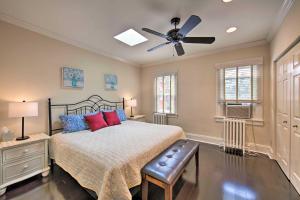 a bedroom with a bed and a ceiling fan at Lancaster Townhome Walk to Central Market! in Lancaster