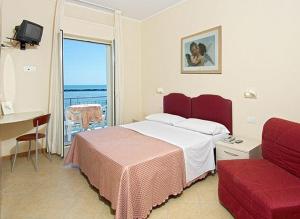 Postel nebo postele na pokoji v ubytování Hotel Souvenir