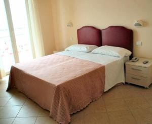 Postel nebo postele na pokoji v ubytování Hotel Souvenir
