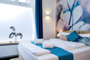 Ένα ή περισσότερα κρεβάτια σε δωμάτιο στο HOMELY STAY Studio 5 - Trendy Self-Check-In Stay in Munich- 15 min from Oktoberfest +9 φωτογραφίες