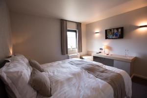 Letto o letti in una camera di Hotel De Lissewal