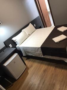 A bed or beds in a room at Hotel Cerrado