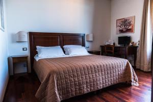 Katil atau katil-katil dalam bilik di Terrazza con vista Etna e centro storico by Wonderful Italy