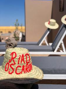 a hat with the words had santa written on it at Riad Oscaroi in Marrakesh