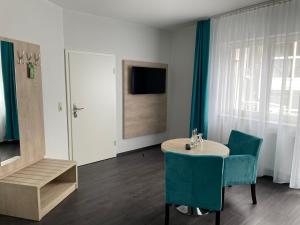 TV a/nebo společenská místnost v ubytování Hotel Steakhouse Am Rathaus