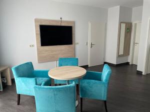 TV a/nebo společenská místnost v ubytování Hotel Steakhouse Am Rathaus