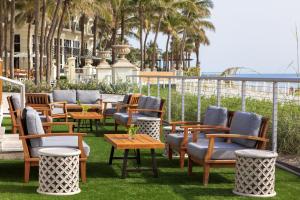 a row of chairs and tables on a patio at Kimpton Vero Beach Hotel & Spa, an IHG Hotel in Vero Beach