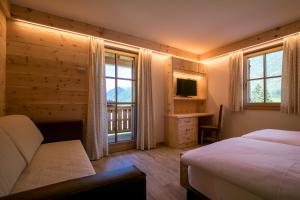 TV a/nebo společenská místnost v ubytování Agriturismo Malga Piè