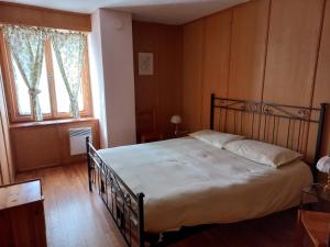 Postel nebo postele na pokoji v ubytování Casa Vacanza Ponte Aino
