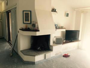 TV a/nebo společenská místnost v ubytování Villa con vista sull’arcipelago della Maddalena