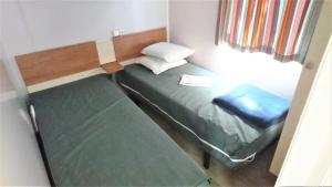 Postel nebo postele na pokoji v ubytování Mobil home 6 personnes PORT LA NOUVELLE