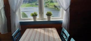 Postel nebo postele na pokoji v ubytování Vassel gård