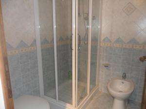 a bathroom with a shower and a toilet at La Civetta in Torrita di Siena +19 photos