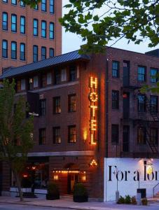 a brick building with a sign for a hotel at The Dean Hotel in Providence
