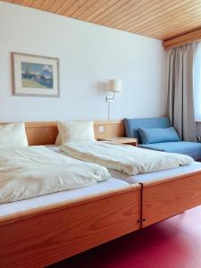 Postel nebo postele na pokoji v ubytování Hotel Gletscherblick