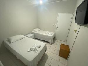 Rúm í herbergi á Hotel Bianchi