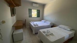 A bed or beds in a room at Hotel Bianchi