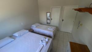 Rúm í herbergi á Hotel Bianchi