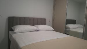 Postel nebo postele na pokoji v ubytování Bellissima Apartments