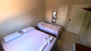 Rúm í herbergi á Hotel Bianchi