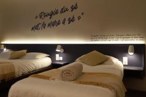 Postel nebo postele na pokoji v ubytování Hôtel Antares & Spa
