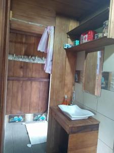 a bathroom with a sink and a mirror at Nido de Vida in San Miguel de los Bancos