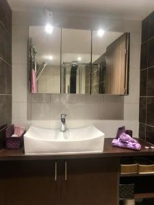 a bathroom with a sink and a mirror at Sabbia Beach House in Alykes +11 photos