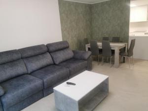 a living room with a couch and a table at Apartamento Justina 2 in Los Mártires