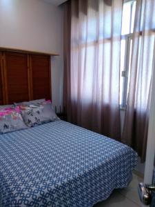 A bed or beds in a room at Loft Aconchegante no Centro de Niterói!