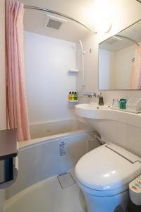 a bathroom with a toilet and a sink and a tub at IMANO OSAKA SHINSAIBASHI HOSTEL - Vacation STAY 27589v in Osaka