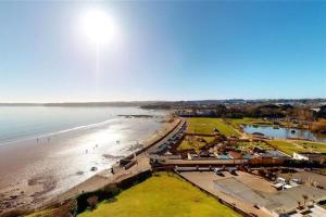 an aerial view of a beach and the ocean at High gables Apartment 1 in Paignton
