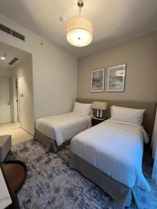 Postel nebo postele na pokoji v ubytování Apartment Fujairah + 23 fotografií