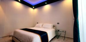 Postel nebo postele na pokoji v ubytování Ercolano Luxury Suite