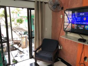 Μια τηλεόραση ή/και κέντρο ψυχαγωγίας στο Casa na melhor localidade de BC