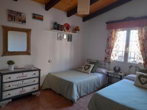 Ένα ή περισσότερα κρεβάτια σε δωμάτιο στο VIVENCIAS casa rural para 10 personas