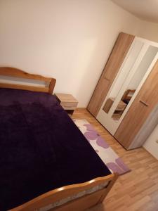 Postel nebo postele na pokoji v ubytování Apartman Giovanni