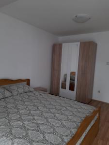 Postel nebo postele na pokoji v ubytování Apartman Giovanni