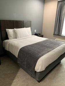 Cama o camas de una habitación en Monti Hotel