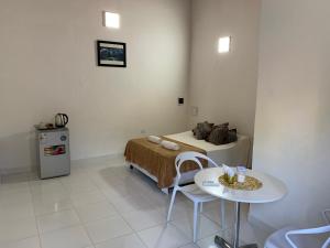 En eller flere senge i et værelse på Las Salinas Hostal