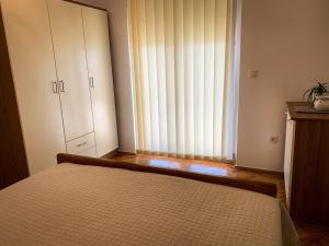 Postel nebo postele na pokoji v ubytování Apartments Gurman