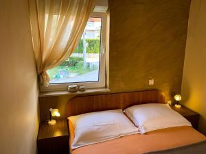 Postel nebo postele na pokoji v ubytování Apartments Gurman
