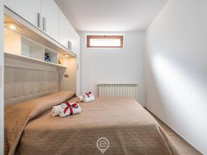 Posteľ alebo postele v izbe v ubytovaní Villa Monica - Suite Scirocco