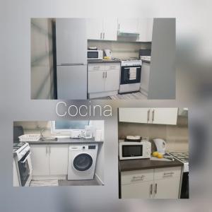 a white kitchen with a sink and a microwave at Apartamentos Jose in Playa de San Juan