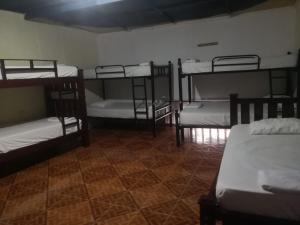 a room with four bunk beds in a room at Casa Hostal Luna Llena in Cartagena de Indias